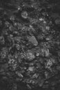 Closeup of dark rock textured background. Gray rough stone texture and background for design.