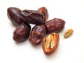 date fruit with seeds on white background.