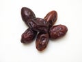 Date fruit with seeds on white background.