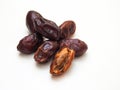 Date fruit with seeds on white background.