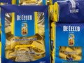 Closeup of de cecco parpadelle noodle packs in shelf of german supermarket focus on center of big blue text left pack Royalty Free Stock Photo