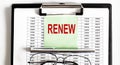 Closeup of the deadline time of RENEW and glasses and pen Royalty Free Stock Photo