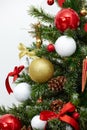 Closeup of a decorated Christmas tree, isolated white background Royalty Free Stock Photo