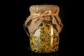 closeup decorated in rustic style glass jar with dried spices