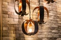 Closeup of Decorative antique edison style filament light bulbs on brick wall Royalty Free Stock Photo