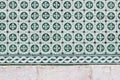 Closeup of decorative floral tiles. Traditional Portuguese ceramic tile pattern, azulejos. Cclover. Irish green color