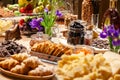 Closeup degustation premium cognac and snacks, fresh and dried fruits, pieces parmesan cheese, honeycombs, dark chocolate, Royalty Free Stock Photo