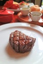 Delectable Grilled Filet Mignon Steak with Blurry Side Dish in the Backdrop