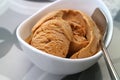 Closeup delectable homemade caramel ice cream in a white bowl