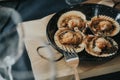 Closeup of delicious baked scallops with cheese and spicy sauce in a restaurant