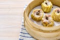 Closeup of delicious Chinese shumai dumplings on a xiaolong bamboo steaming basket Royalty Free Stock Photo