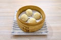 Closeup of delicious Chinese xiaolongbao steamed buns on a xiaolong bamboo steaming basket Royalty Free Stock Photo