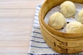 Closeup of delicious Chinese xiaolongbao steamed buns on a xiaolong bamboo steaming basket Royalty Free Stock Photo