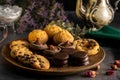 Closeup of delicious cookies on a wooden plate with an old teapot on table Royalty Free Stock Photo