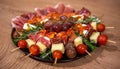 Closeup of the delicious and good-looking Italian antipasto skewers on the plate on the wooden table