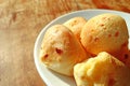 Closeup Delicious Pao de Queijo, Traditional Brazilian Cheese Breads Served on Wooden Table