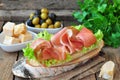 Closeup of delicious parma ham sandwich on wooden backgraund table Royalty Free Stock Photo