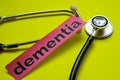 Closeup dementia with stethoscope concept inspiration on yellow background