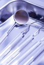 Closeup of dental mirror and tools in dental tray Royalty Free Stock Photo