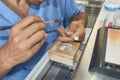 Closeup of dental technician putting ceramic to dental implants Royalty Free Stock Photo