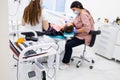 Closeup of a dentist and assistant treating a patient in dental clinic Royalty Free Stock Photo