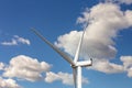 Closeup detail back view of new white modern wind turbine farm power generation station against clear blue sky on day Royalty Free Stock Photo