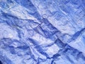 Closeup detail of blue plastic tarpaulin at an outdoor construction site Royalty Free Stock Photo