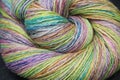 Closeup detail of colourful ball of wool, skeins of organic handspun merino sheep wool, spun on a traditional spinning wheel Royalty Free Stock Photo