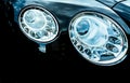 Closeup detail of LED headlight luxury car. Beautiful modern elegance headlamp car. Black automobile. Automotive industry Royalty Free Stock Photo