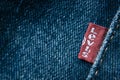 Closeup detail of levi`s red tag on levi`s jeans