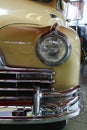 Closeup detail of massive front mask and round headlights of american full size retro car Pontiac Torpedo from year 1946