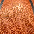 Closeup detail of orange basketball ball texture background with empty space for text Royalty Free Stock Photo