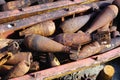 Closeup detail of a pile of rusty grenades, bombs and unexploded ordnance in rural Laos Royalty Free Stock Photo