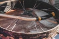 Closeup detail of a primitive shamanic spiritual meditation ritual leather drum with a natural handmade wild wood branch drumstick