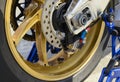 Closeup detail of a race motorcycle rear wheel and brake disc