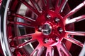 Closeup detail of Red Aluminum car wheel. Neural network AI generated