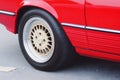Closeup detail of Red Aluminum car wheel. Neural network AI generated