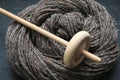 Closeup detail of a skein of organic natural handspun alpaca wool yarn with a wooden spindle Royalty Free Stock Photo