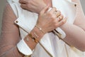 Closeup detail woman with stylish bijouterie bracelet and ring