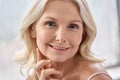 Closeup detailed portrait of beautiful 50 years old woman with perfect skin. Royalty Free Stock Photo