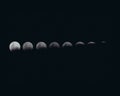 Closeup detailed shot of different phases of the moon in a dark night sky Royalty Free Stock Photo