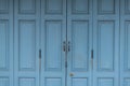 Closeup detailed texture of blue paint peeling off of an old wooden door Royalty Free Stock Photo