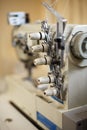 Closeup details on sewing machine overlock. Workplace seamstress.Tailoring industry