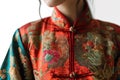closeup details of traditional red silk chinese clothing on young woman