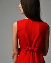 Closeup details of woman red dress bow knot Royalty Free Stock Photo