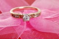 Closeup Diamond Ring On Pink Lace