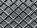 Closeup of a diamondpatterned metal grid texture background Royalty Free Stock Photo