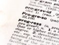 Closeup of the dictionary definition of the word progress Royalty Free Stock Photo