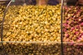 Closeup of different natural dry herbal roses tea in the special box on the street market