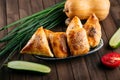 Different oriental baked pie with meat samsa